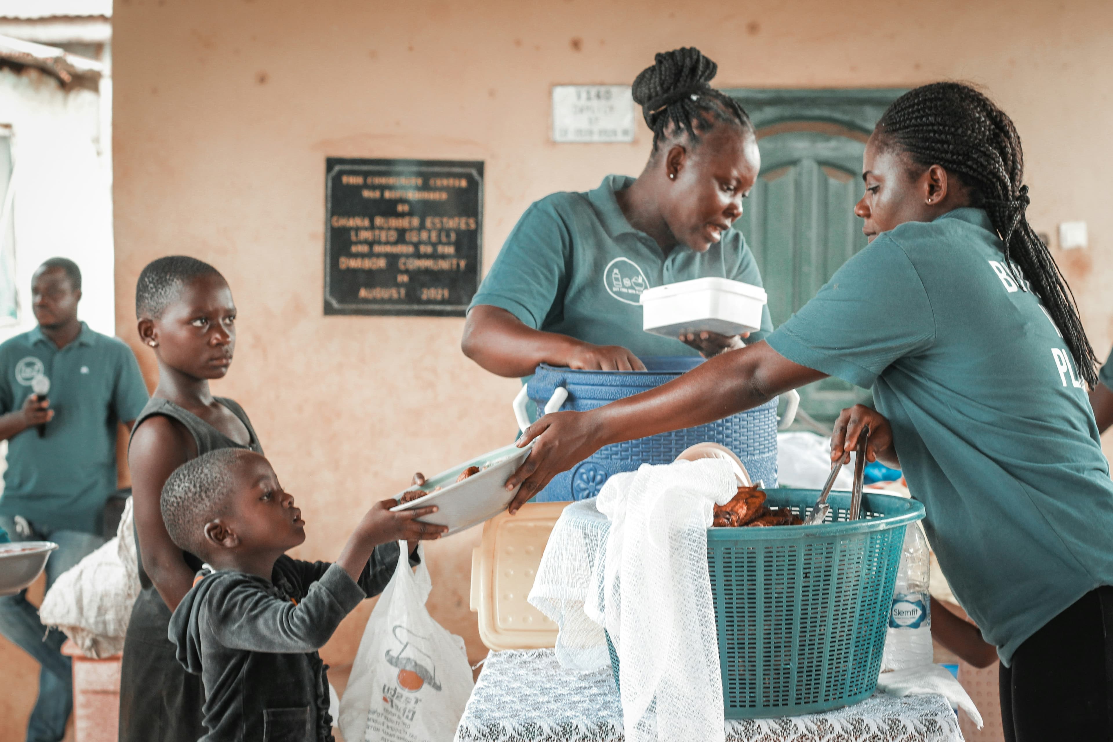 Volunteers distribute supplies at a community aid day